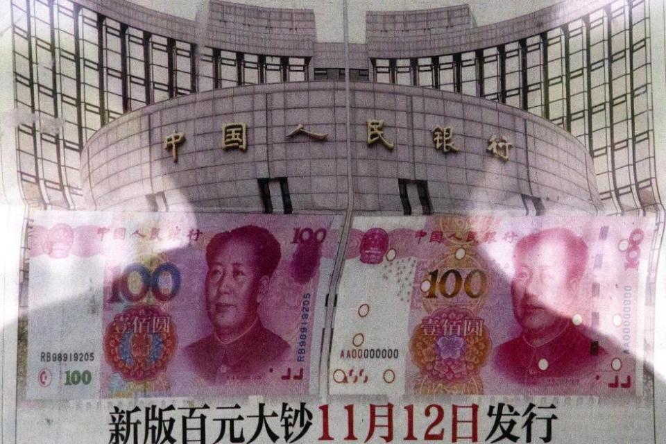 China accelerates digital yuan push and eyes stablecoin routes

Beijing is stepping up promotion of the e-CNY to boost the yuan’s global role, with pilot usage already tallying trillions of yuan in transactions. Policymakers and researchers are also floating a yuan-backed stablecoin—potentially routed via Hong Kong’s new rules—as part of a broader response to the dominance of dollar stablecoins. Barriers remain: convertibility limits and capital controls still constrain adoption.

📸In this Aug. 11, 2015 photo, a shadow of a man is reflected on a glass as he reads a newspaper reporting China’s central bank or People’s Bank of China announced the 2015 edition of the 100 renminbi notes will be issued starting from November 12, at a stand in Beijing. (AP Photo/Andy Wong, File)